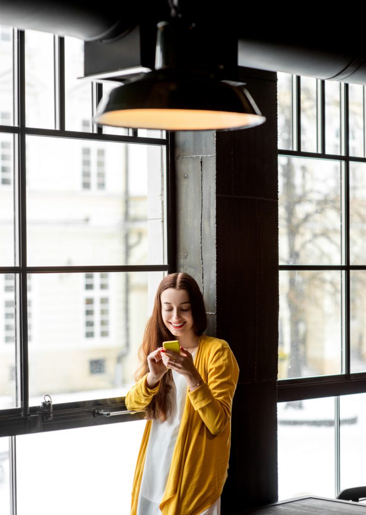 A woman reading an article on personal development.